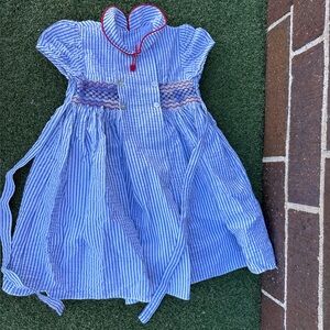 La Coqueta Toddler Blue and White Striped Girls' Smocked Dress with Red Trim